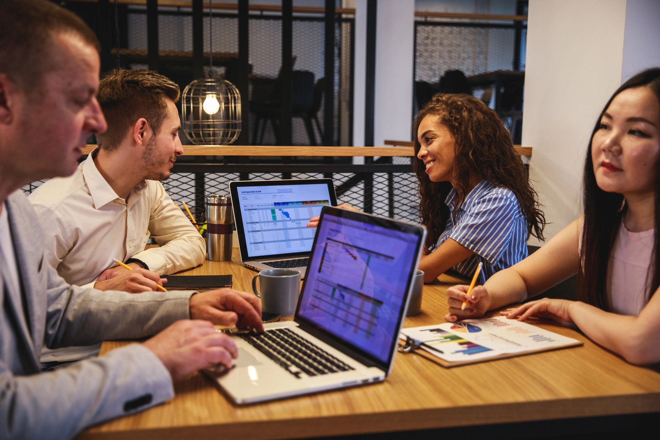 Meeting of diverse business partners in a board room