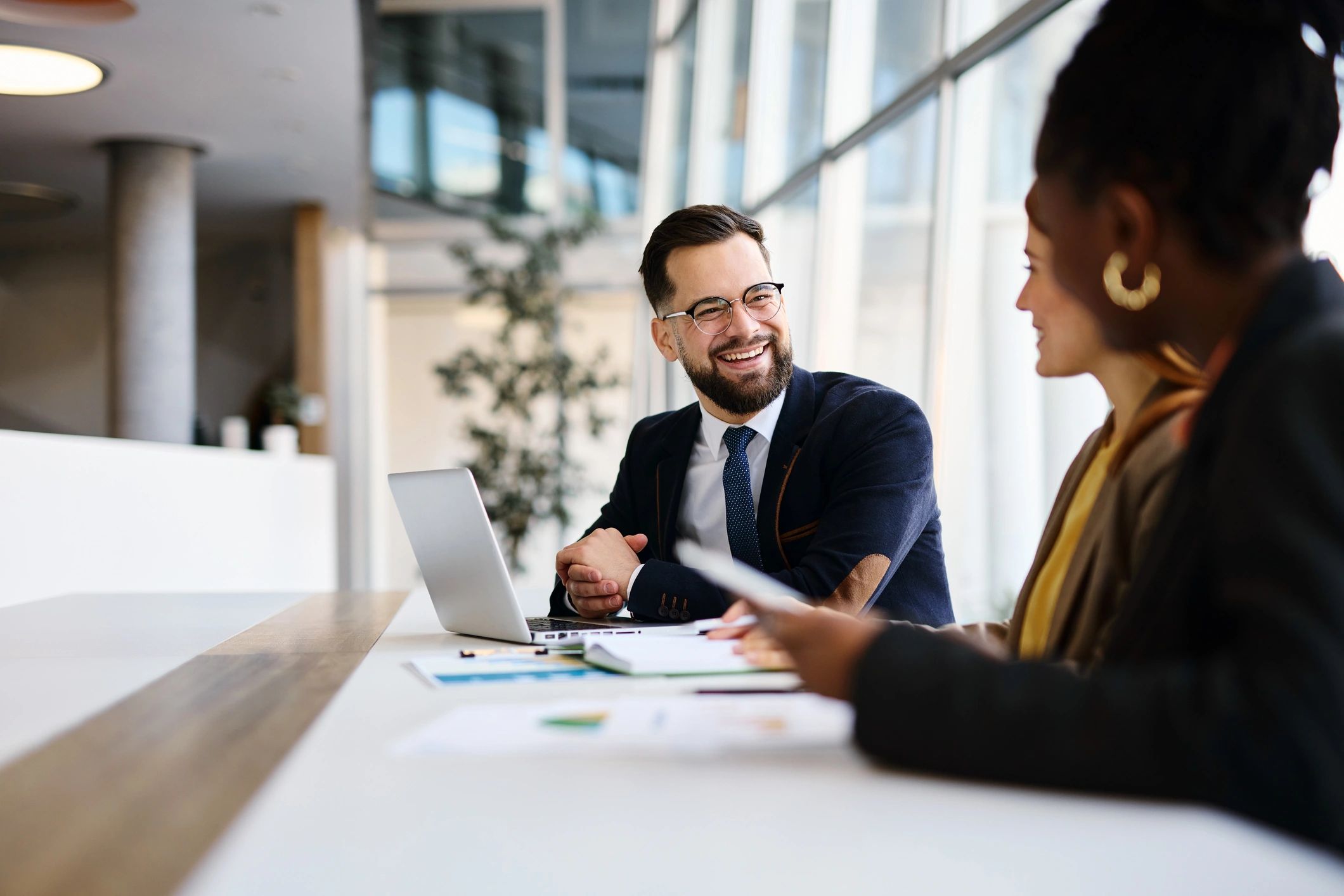 Business partners discussing strategy in modern office during meeting